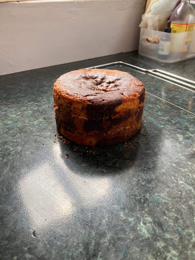 a cake cut in 3 layers with a cake saw